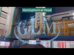 The vertical lathe is machining a hemispherical head.